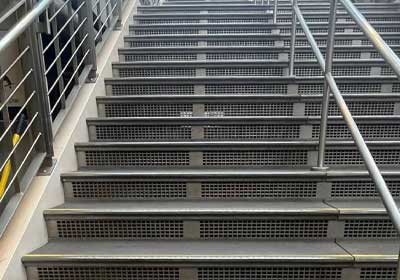Close-up of retrofit stair nosing installed on office staircase