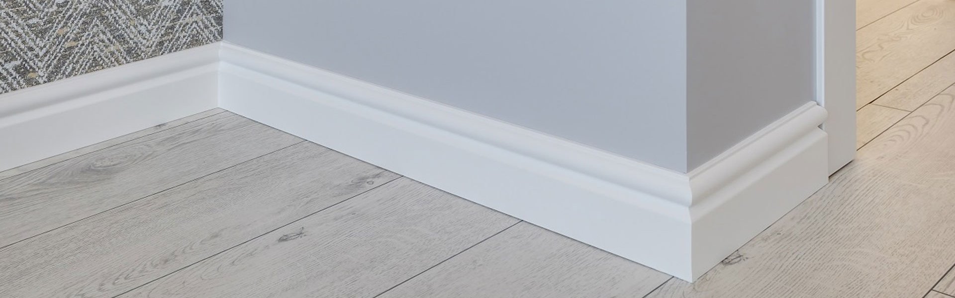 Comparison of skirting board styles with wooden, laminate, tiled, and carpet flooring finishes