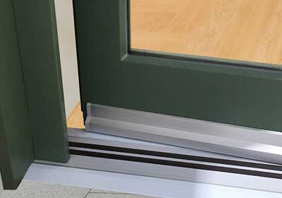 Commercial building door thresholds improving energy efficiency
