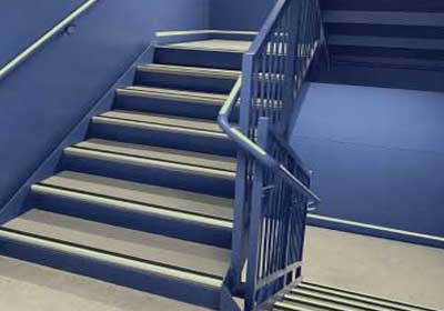 Close-up of Aluminator Slimline stair nosing installed on commercial steps