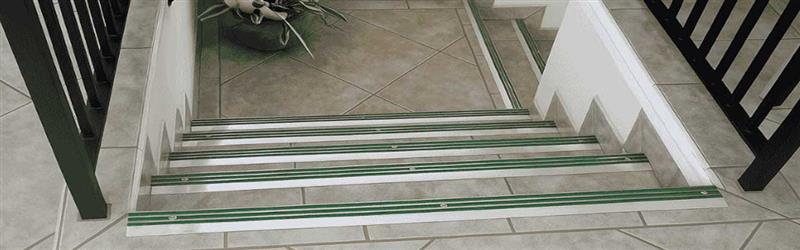 Modern office staircase fitted with Aluminator Slimline stair nosing for safety and style